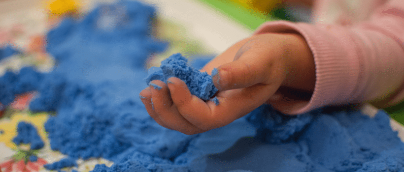 child playing with sand