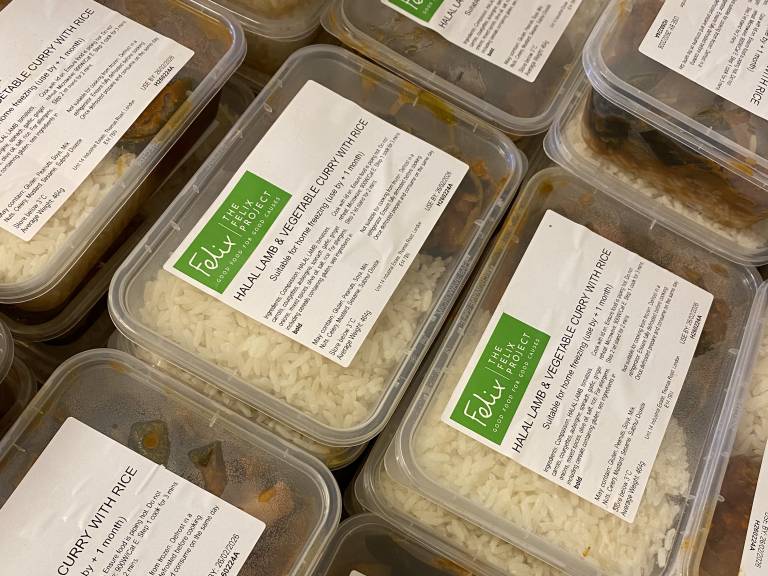 A crate full of our healthier curry and rice meals, all packed up and ready to deliver to community spaces