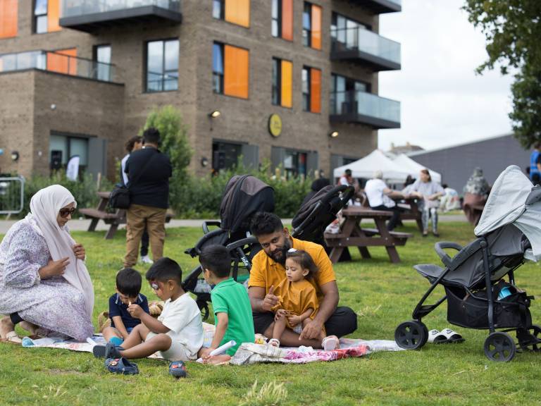 A family enjoy a picnic at Poplar Picnic