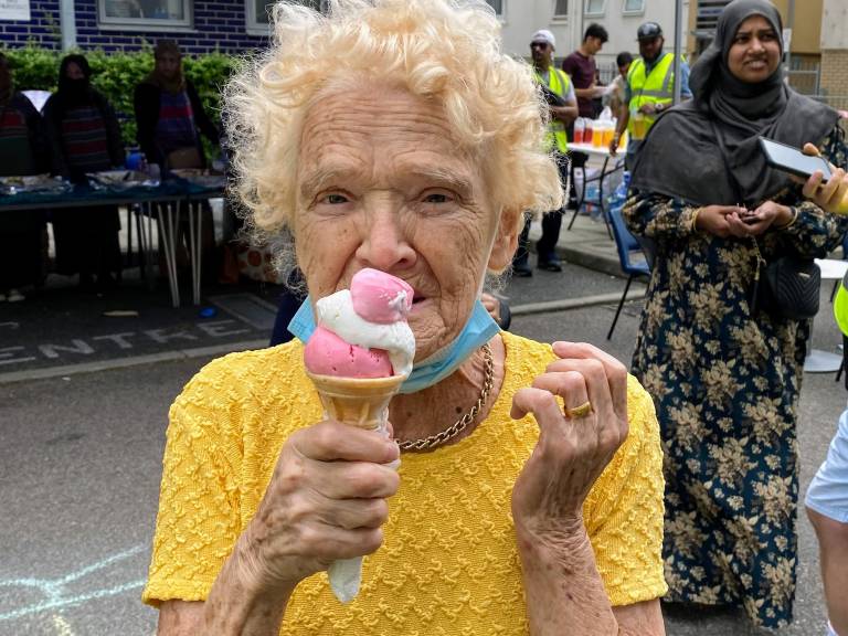 A local resident enjoys an ice cream at the Mile End Summer of Wellbeing festival