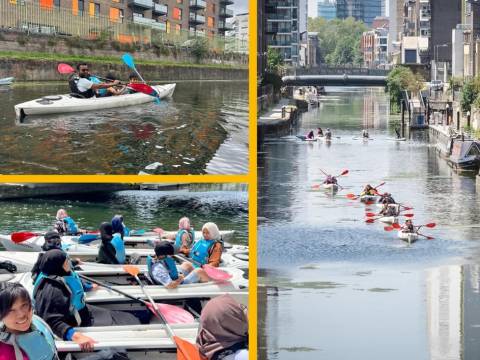 People trying out paddle sports on the Limehouse Cut canal as part of Paddlefest